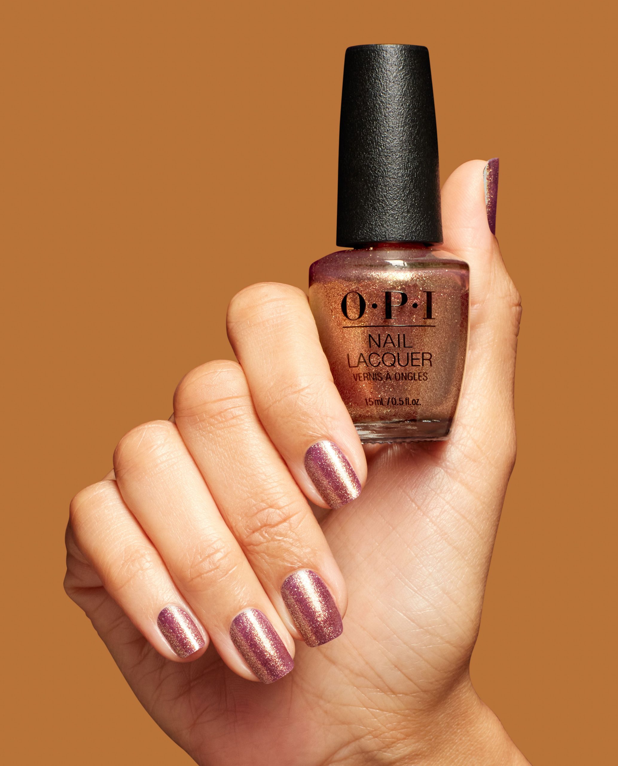 butter_me_up_toffee_hrs09_nail_lacquer_99399001307_hand_and_bottle.jpg