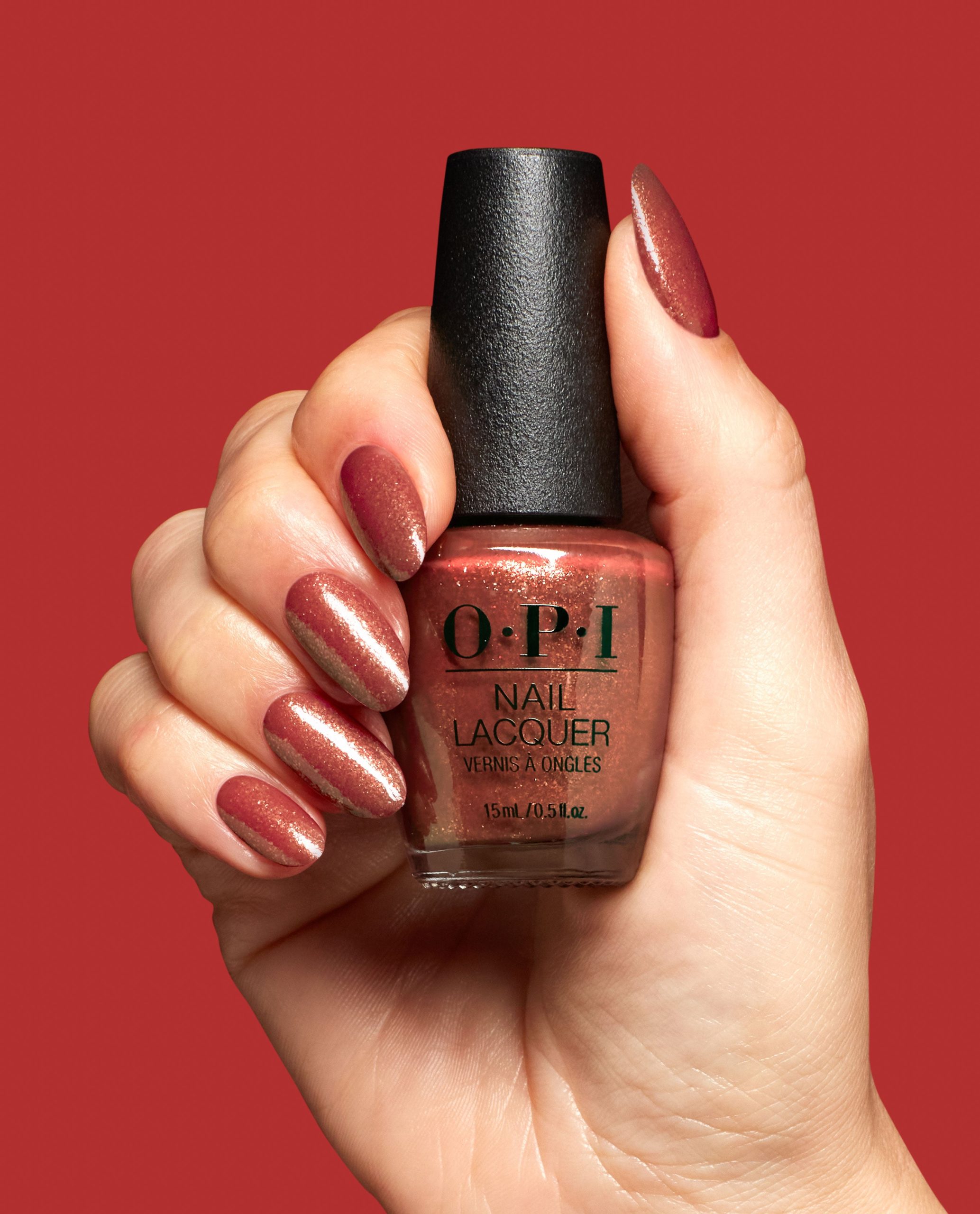 ginger_snapped_hrs06_nail_lacquer_99399001304_hand_and_bottle_cd06e0fa-8d05-4aea-9a0f-e3db7ab95dd1.jpg