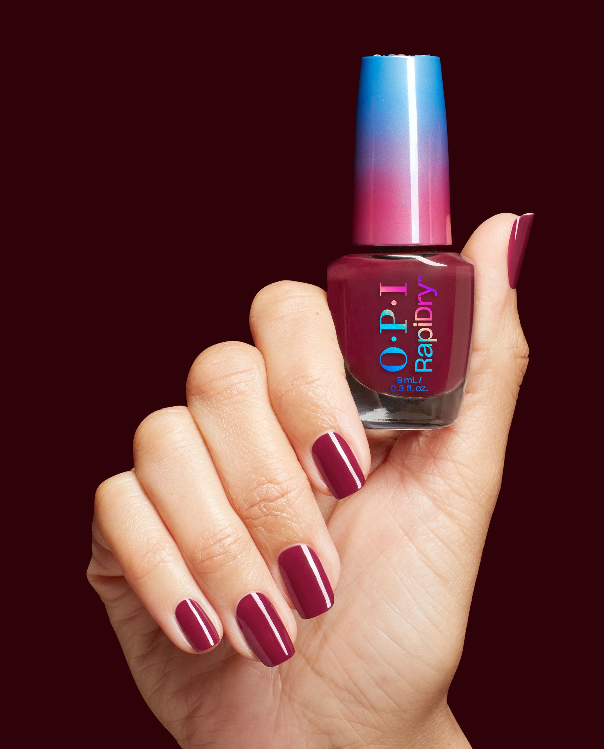 so_berry_quick_rd0032_nail_lacquer_99350188479_hand_and_bottle.jpg